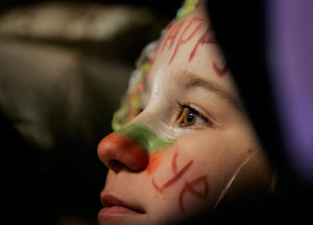 A Bulgarian girl attends celebrations for the New Year at Sofia's main square early January 1, 2007. Fireworks lit the skies and thousands of people danced at street parties across Romania and Bulgaria to celebrate the two former Soviet bloc Black Sea countries' entry to the European Union on Monday.