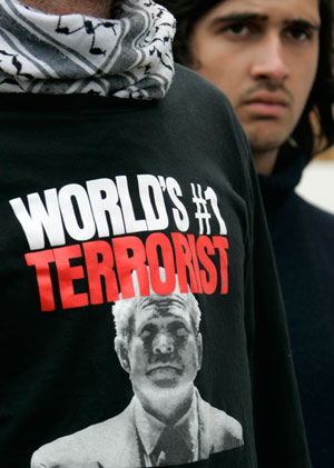 A demonstrator wears a shirt with the portrait of U.S. President George W. Bush during a protest against war and torture before the G8 summit in Rostock June 5, 2007. Leaders from the world's major industrialised nations meet in the Baltic resort of Heiligendamm on June 6-8 for a Group of Eight (G8) summit.