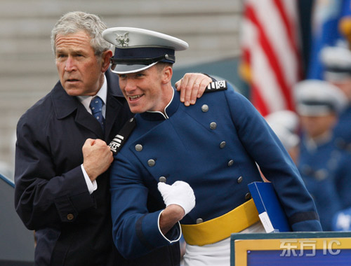 Bush plays chest-bumping with Air Force cadet